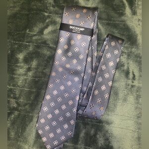 a Duchamp London silk necktie with a gray geometric pattern